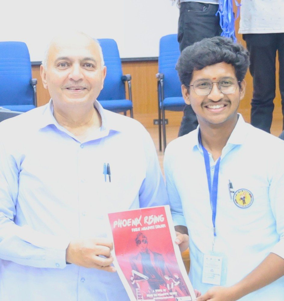 Praneeth and Shri Sandeep Shandilya, Retd. IPS, Director of EAGLE Force, holding a copy of Phoenix Rising: The Fight Against Drugs